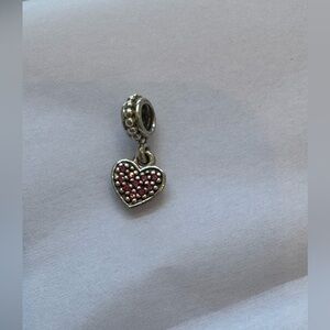 Authentic pandora dangling heart charm
with pink stones